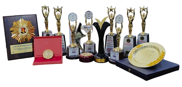 Auraliss Health dental awards and trophies showcasing clinical excellence